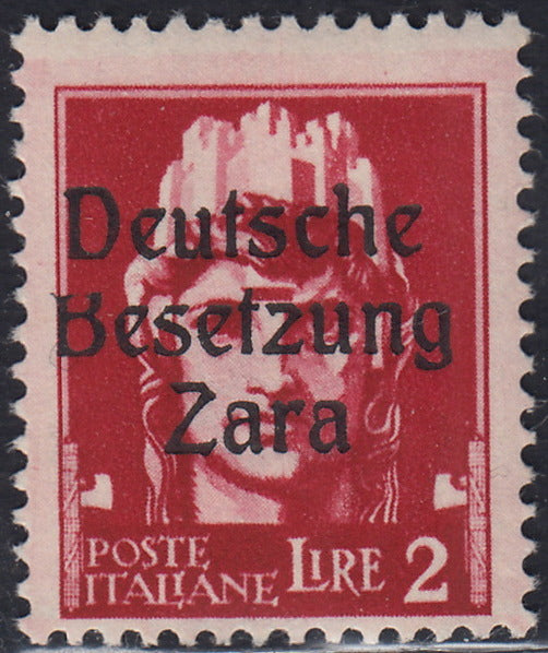RM10_70 - 1943 - Occupazione tedesca di Zara, L. 2 carminio soprastampato "Deutsche Besetzung Zara" e varietà tipografica "B" tagliata in alto nuovo con gomma originale (12h)